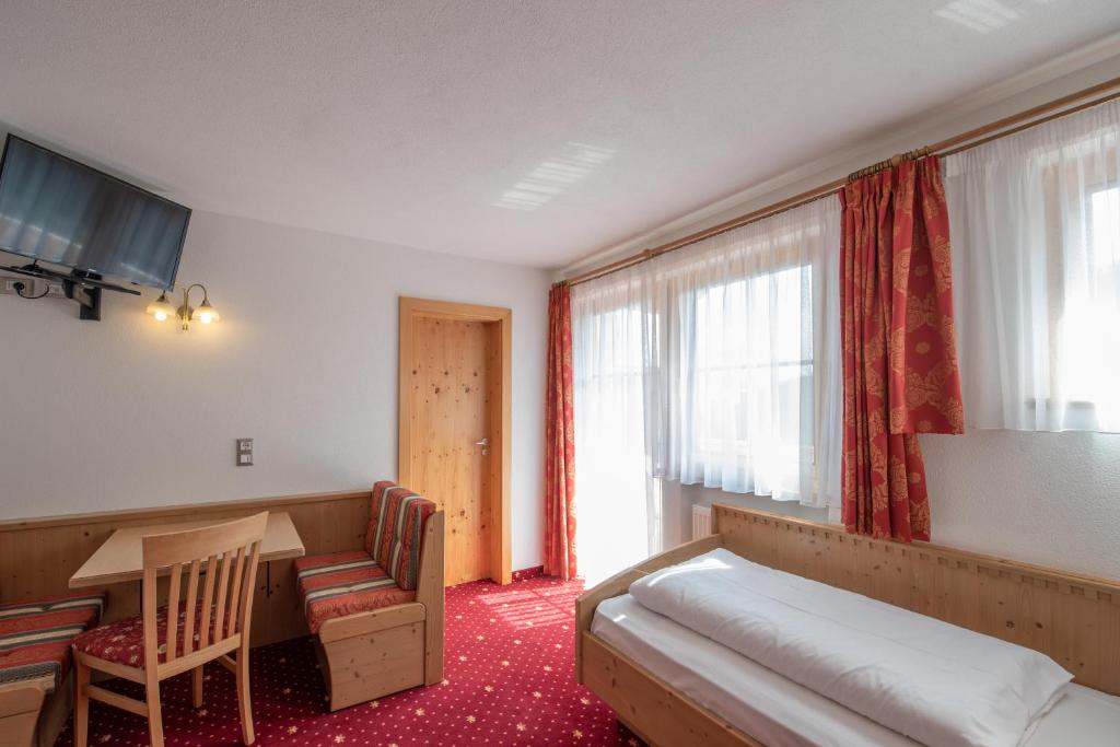 Posteľ alebo postele v izbe v ubytovaní Residence Mühlegg