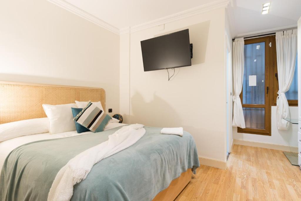 A bed or beds in a room at Pozas by Staynnapartments