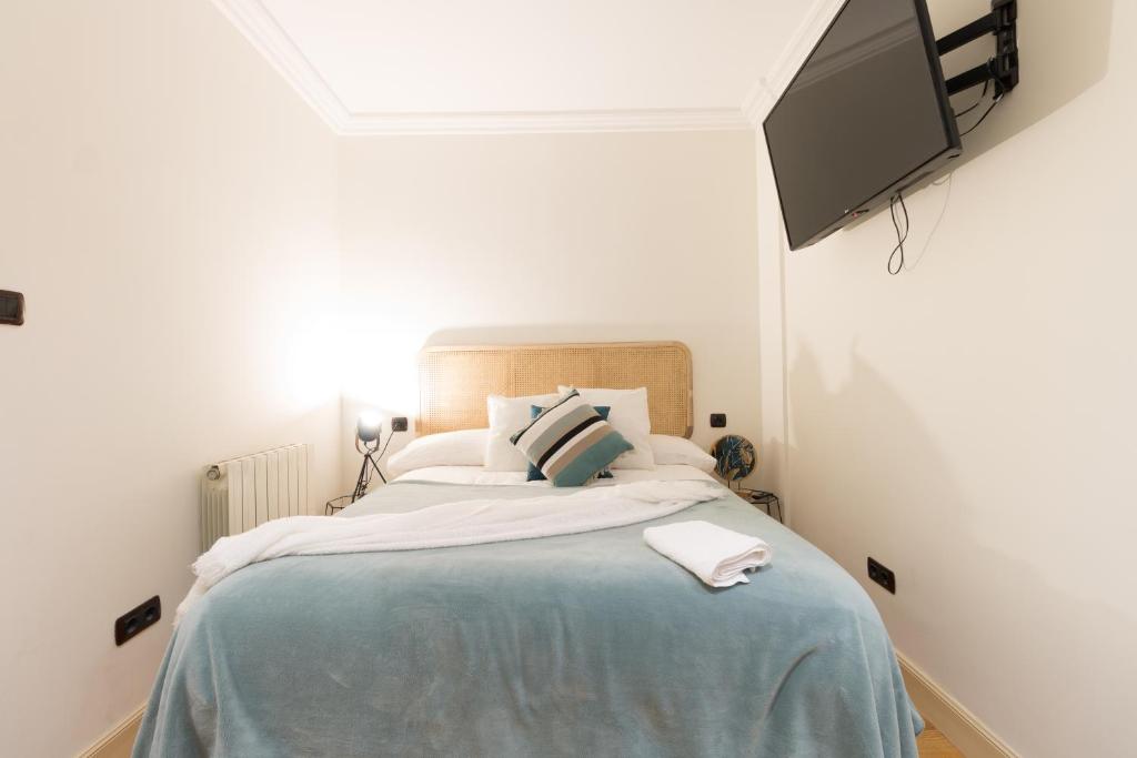 A bed or beds in a room at Pozas by Staynnapartments