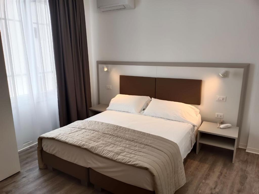 Postel nebo postele na pokoji v ubytování Hotel Splendid