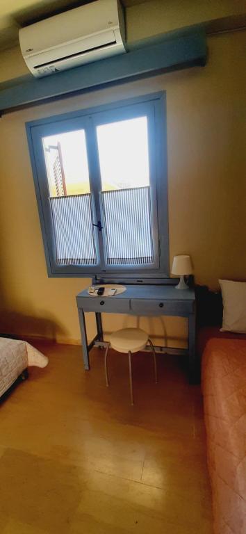 Łóżko lub łóżka w pokoju w obiekcie Aggelika's Home