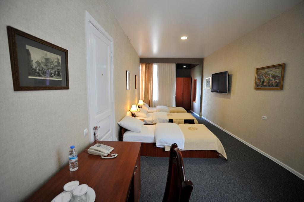 Postel nebo postele na pokoji v ubytování ZP Hotel