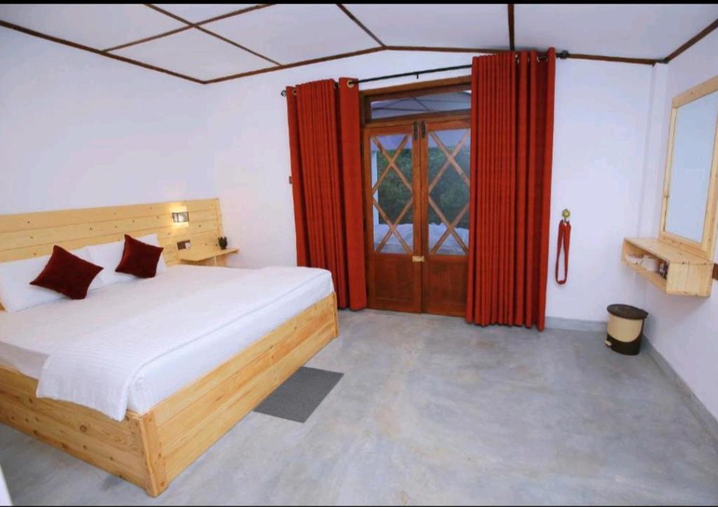 Postel nebo postele na pokoji v ubytování Wingate Homestay