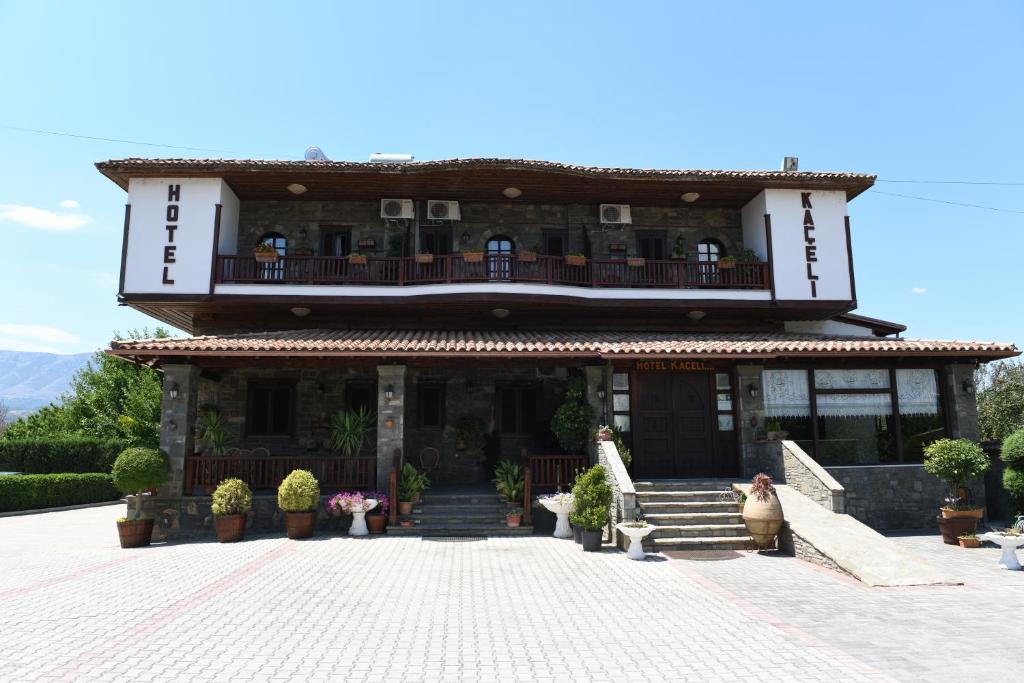 a building with a balcony on top of it at Hotel Kaceli in Berat