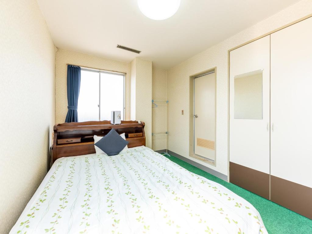 Postel nebo postele na pokoji v ubytování Tabist Business Hotel Chitose Kashiwazaki
