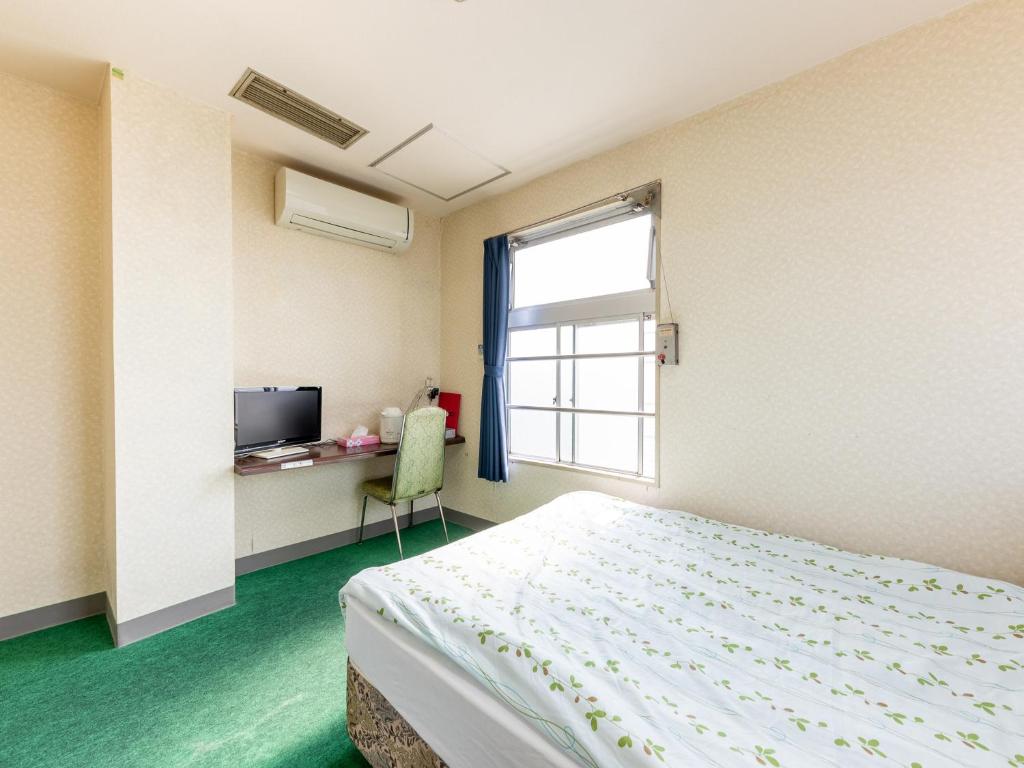 Postel nebo postele na pokoji v ubytování Tabist Business Hotel Chitose Kashiwazaki