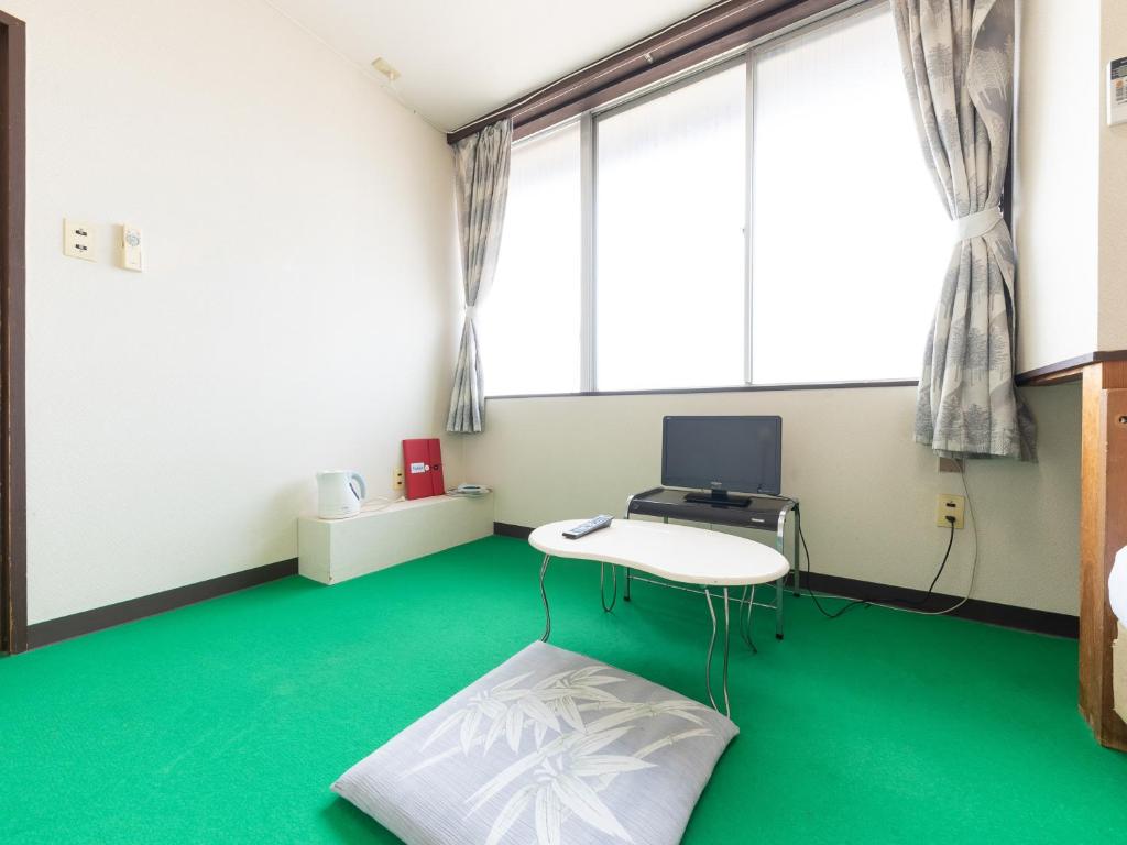 TV a/nebo společenská místnost v ubytování Tabist Business Hotel Chitose Kashiwazaki