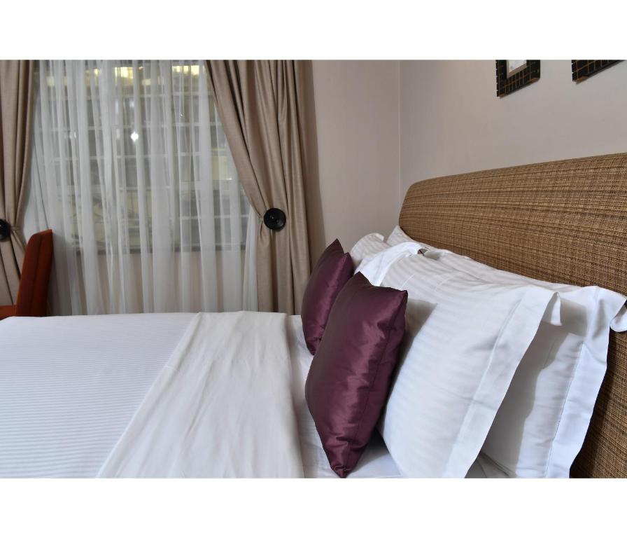 Postel nebo postele na pokoji v ubytování Hillpark Hotel