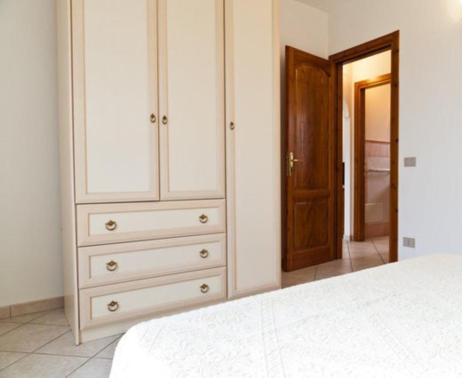 Posteľ alebo postele v izbe v ubytovaní Residence SardegnaSummer Li Cuppulati