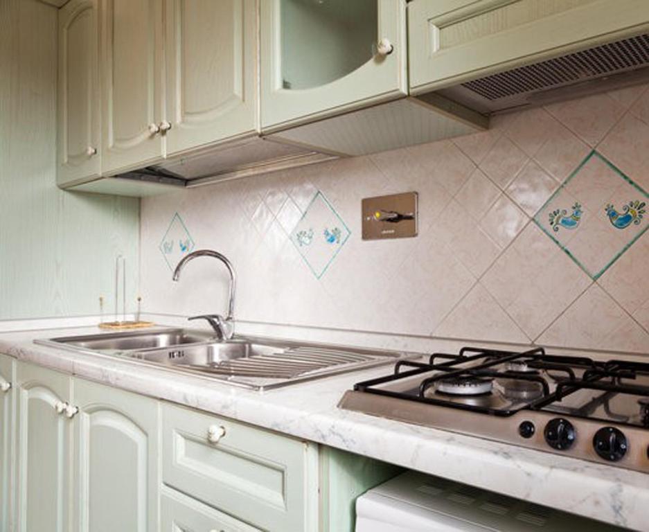 Kuchyňa alebo kuchynka v ubytovaní Residence SardegnaSummer Li Cuppulati