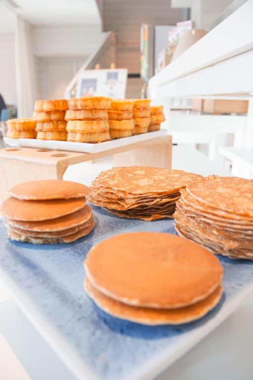 a counter with stacks of uncooked food on it at Novotel Monte-Carlo in Monte Carlo