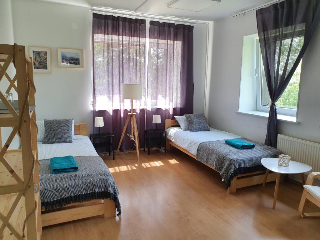 Postel nebo postele na pokoji v ubytování Surf Inn