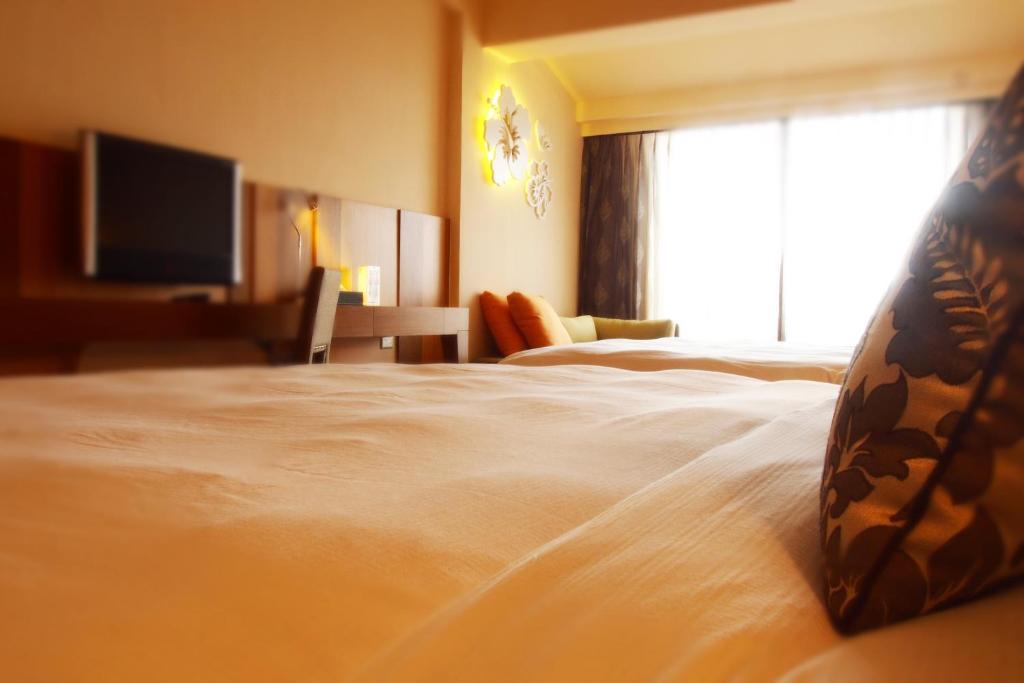 Letto o letti in una camera di Chateau Beach Resort Kenting