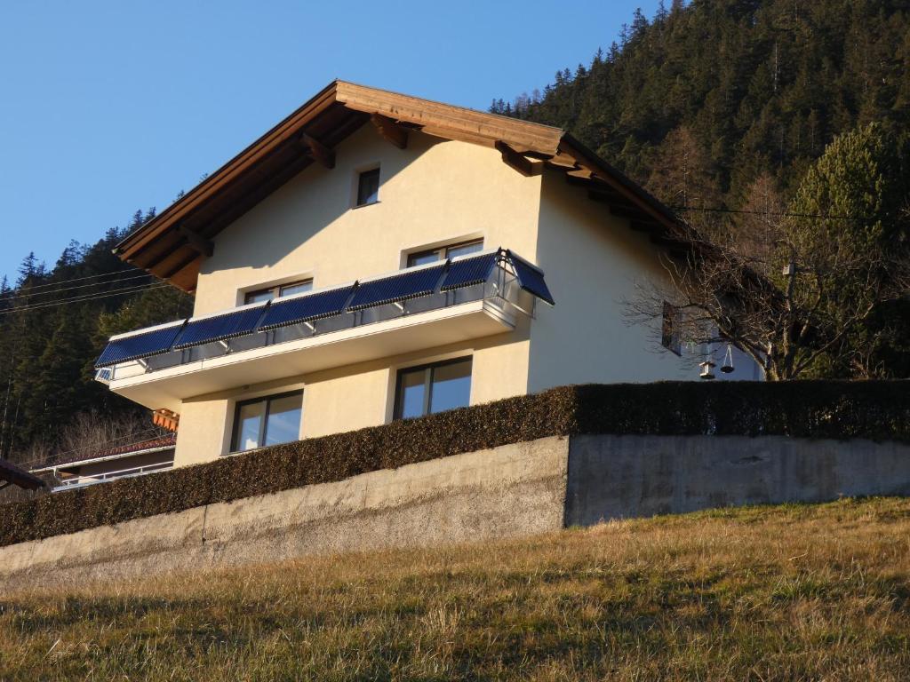 a house on the side of a hill at Haus Alpenrose in Trins