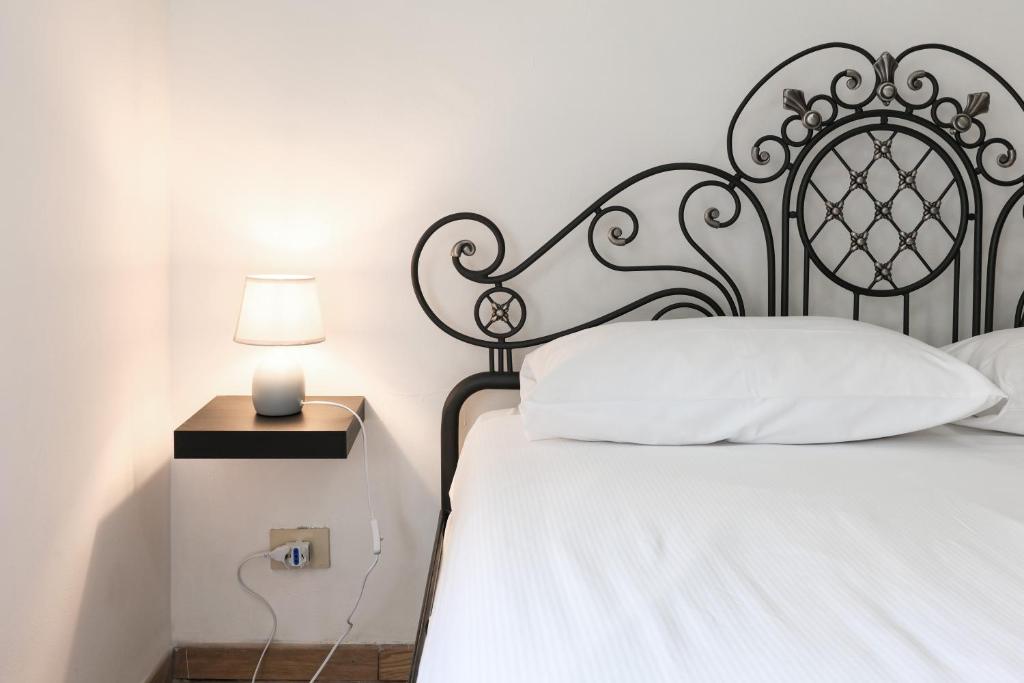 A bed or beds in a room at PrimoPiano - Pellegrino Rossi A