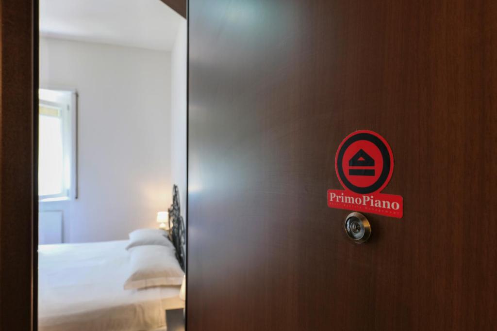 A bed or beds in a room at PrimoPiano - Pellegrino Rossi A