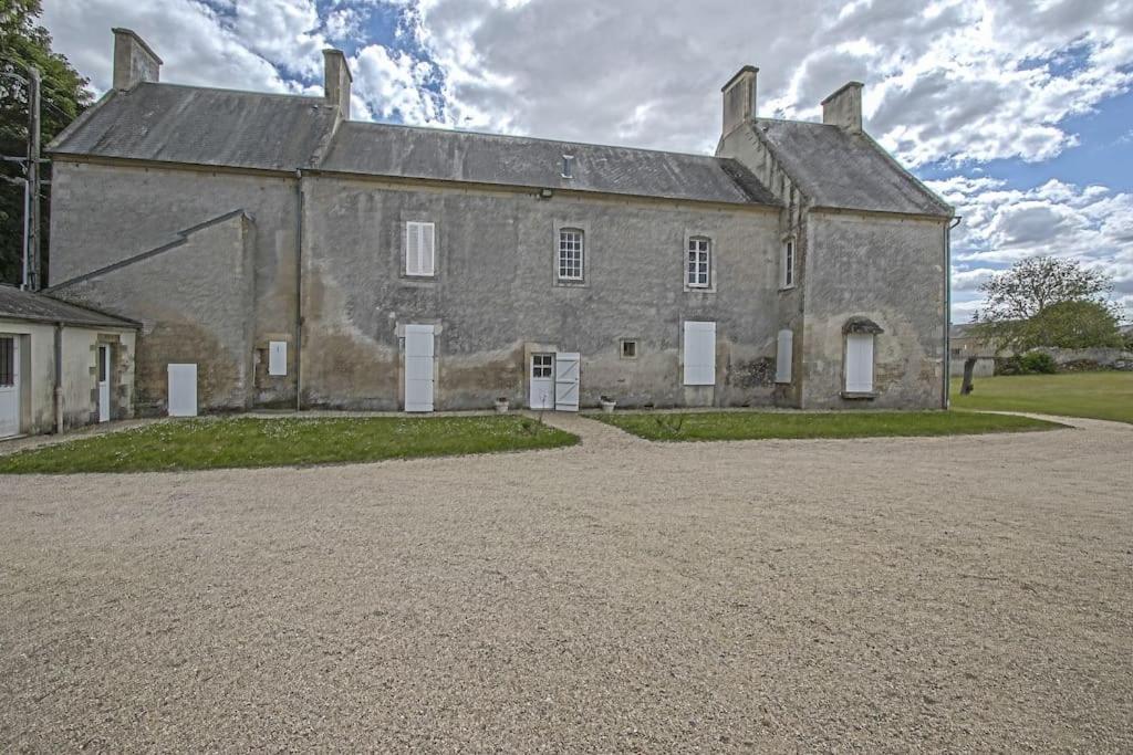 an old stone building with a driveway in front of it at BANVILLE 330 