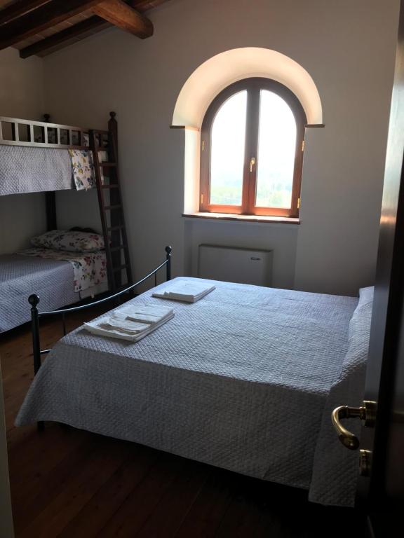 Postel nebo postele na pokoji v ubytování Il vecchio seccatoio