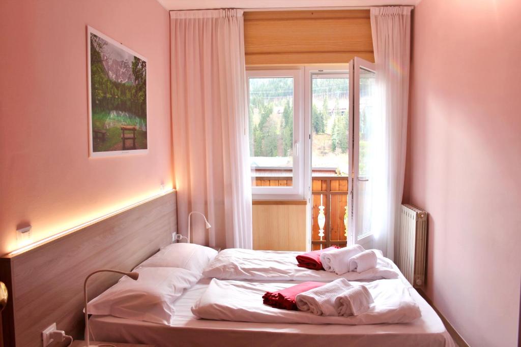 Łóżko lub łóżka w pokoju w obiekcie Adriatico Rooms