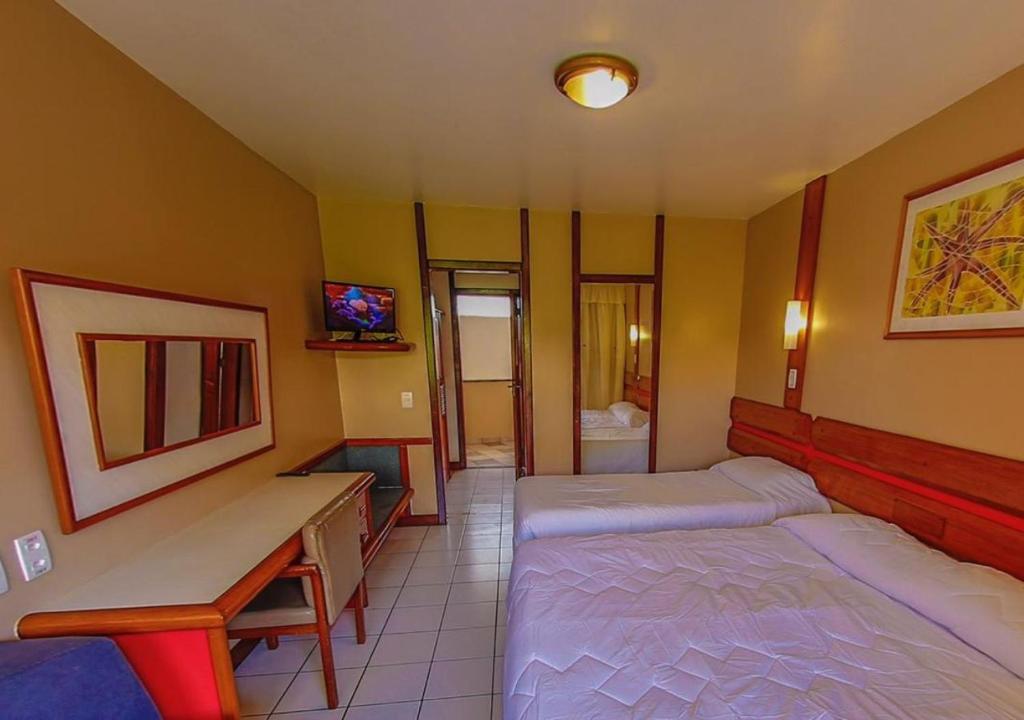 Postel nebo postele na pokoji v ubytování Costa Cabralia Hotel