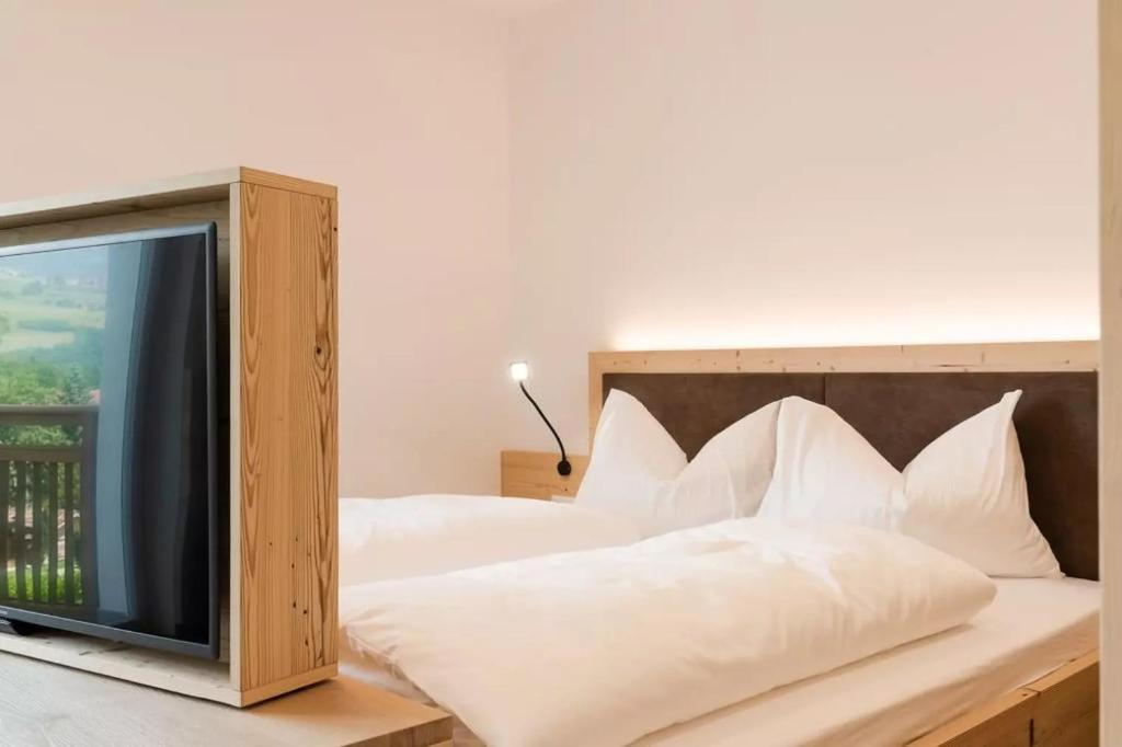 Postel nebo postele na pokoji v ubytování Natur Suite Edelweisshof App Ferdi