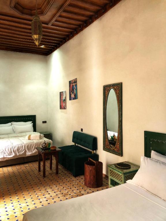 Ένα ή περισσότερα κρεβάτια σε δωμάτιο στο Riad Majorelle