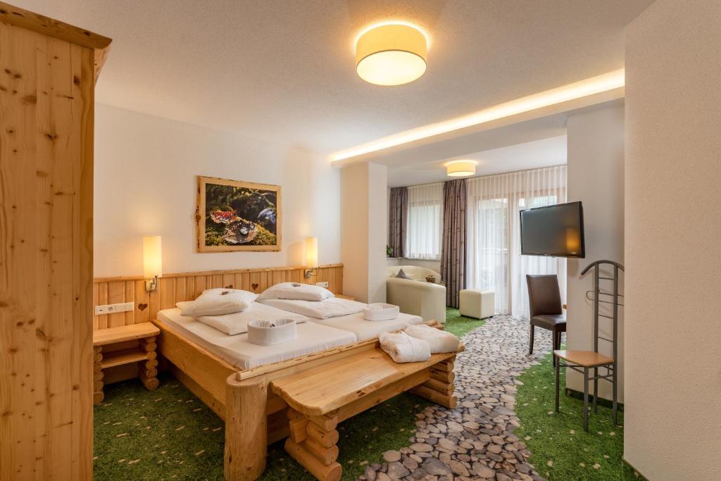 Postel nebo postele na pokoji v ubytování Hartweger's Hotel