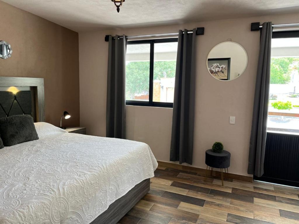Postel nebo postele na pokoji v ubytování Cabañas, Suites y Habitaciones Rancho San Jorge