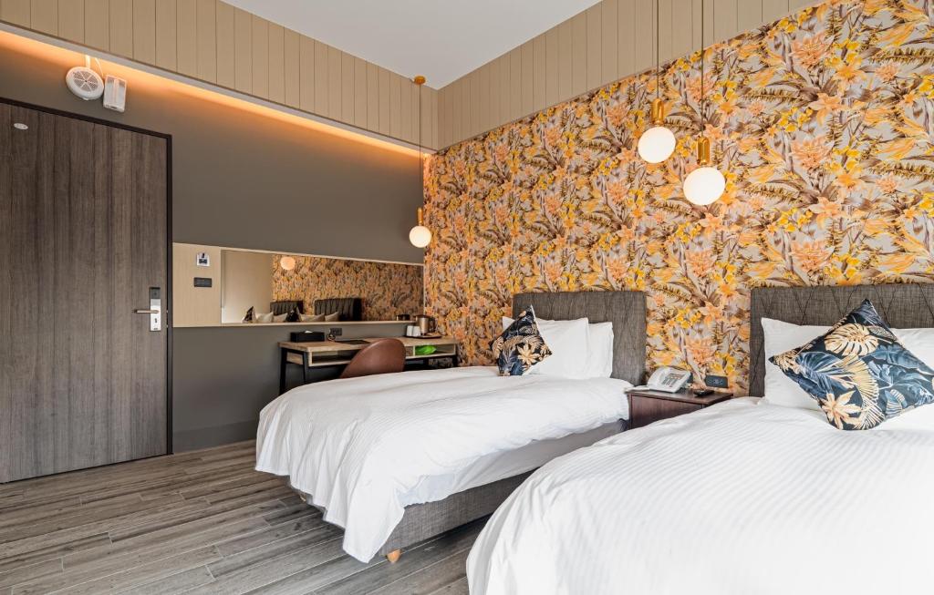 Postel nebo postele na pokoji v ubytování 森行旅 Mori Hotel -台南安平老街