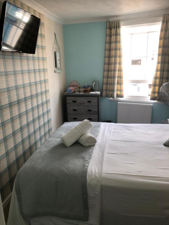 Postel nebo postele na pokoji v ubytování Brighton Surf Guest House