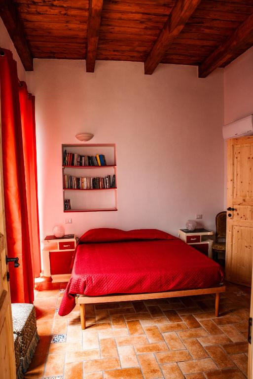 Postel nebo postele na pokoji v ubytování Bobo's House Calasetta