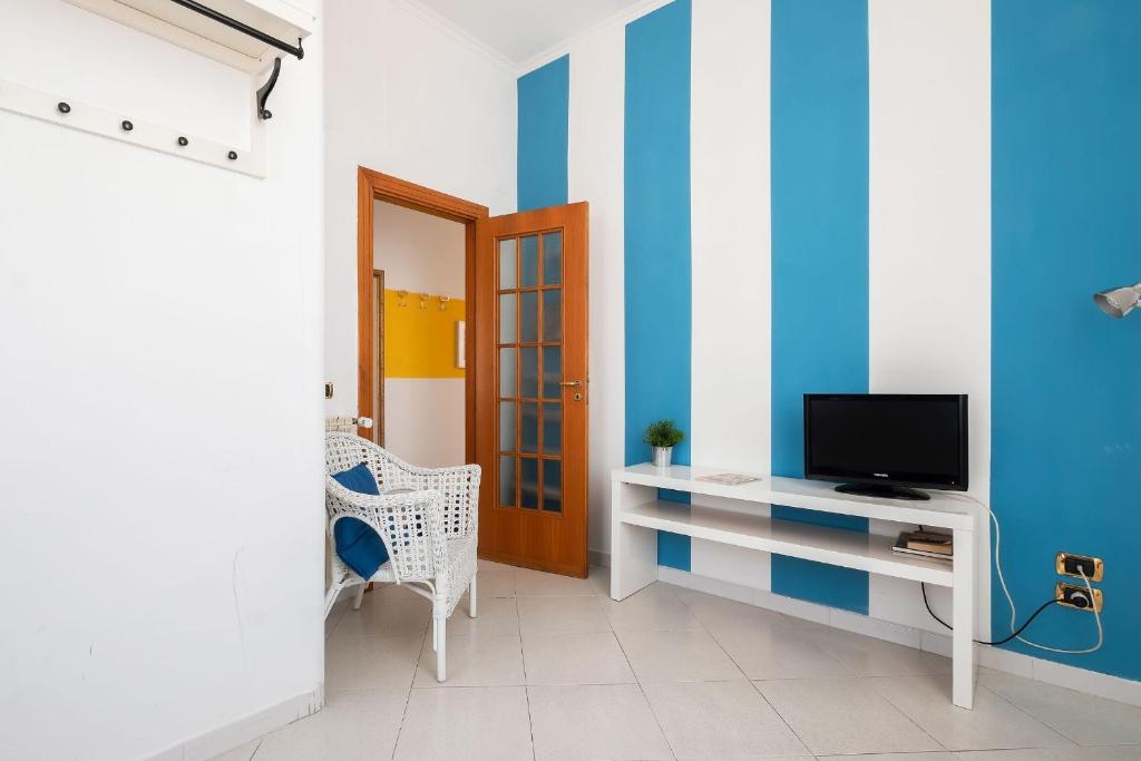 A television and/or entertainment centre at Luce San Lorenzo by Halldis