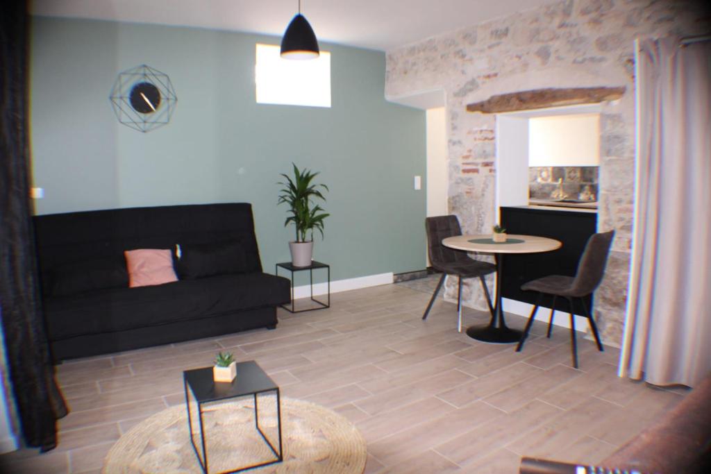 Posezení v ubytování Joli studio en rez-de-chaussée