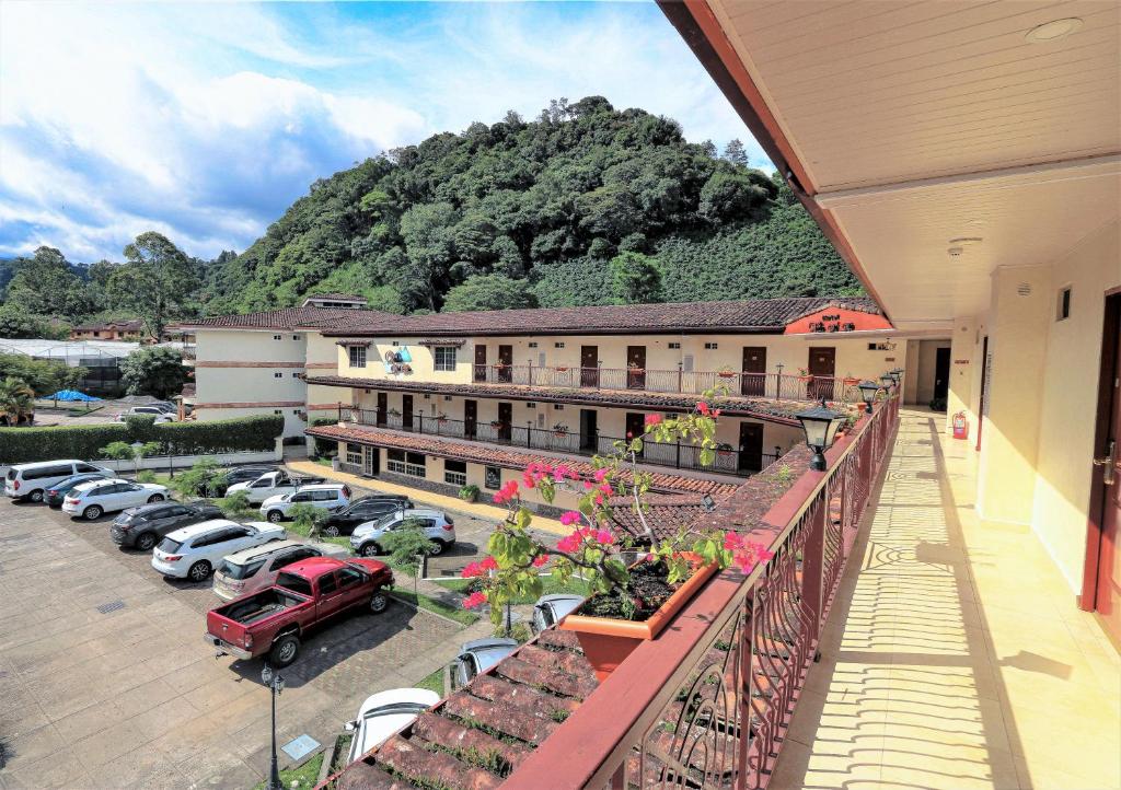arial view of a hotel with a parking lot at Hotel Valle del Rio in Boquete