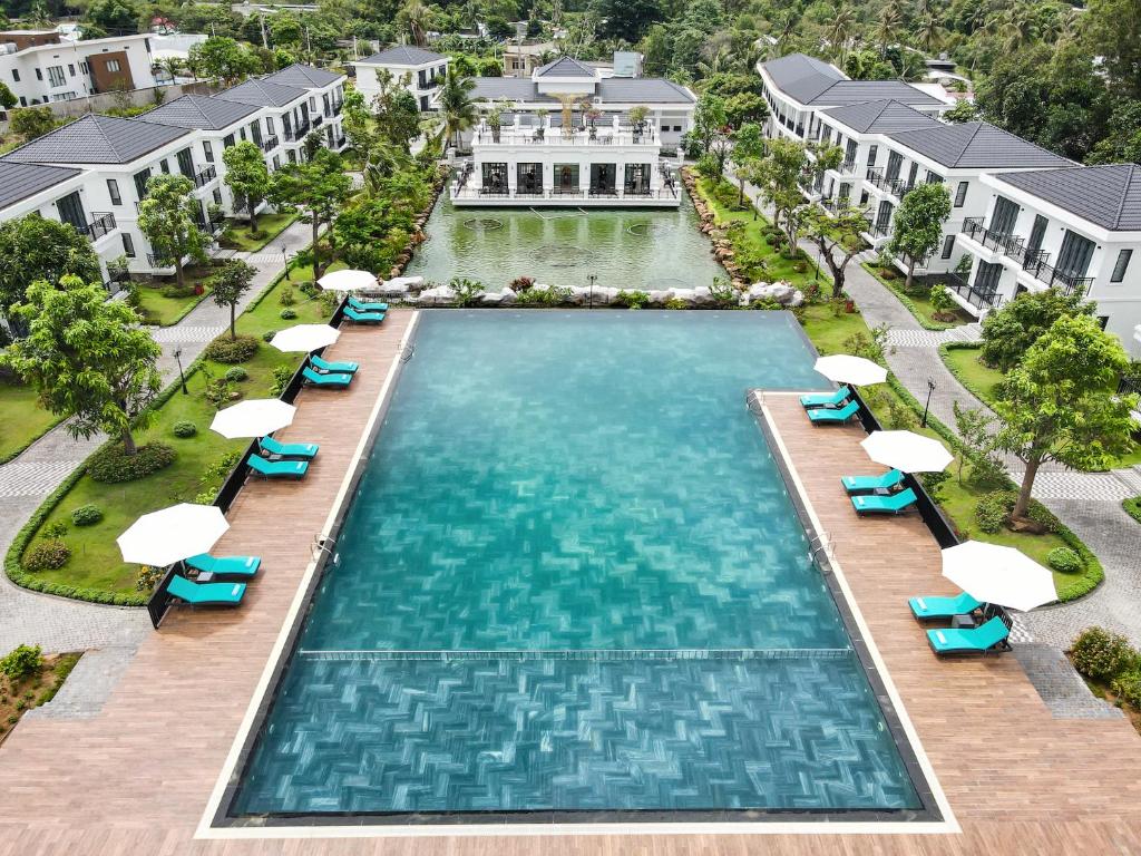an overhead view of a swimming pool at a resort at DAD Resort Phú Quốc in Phú Quốc