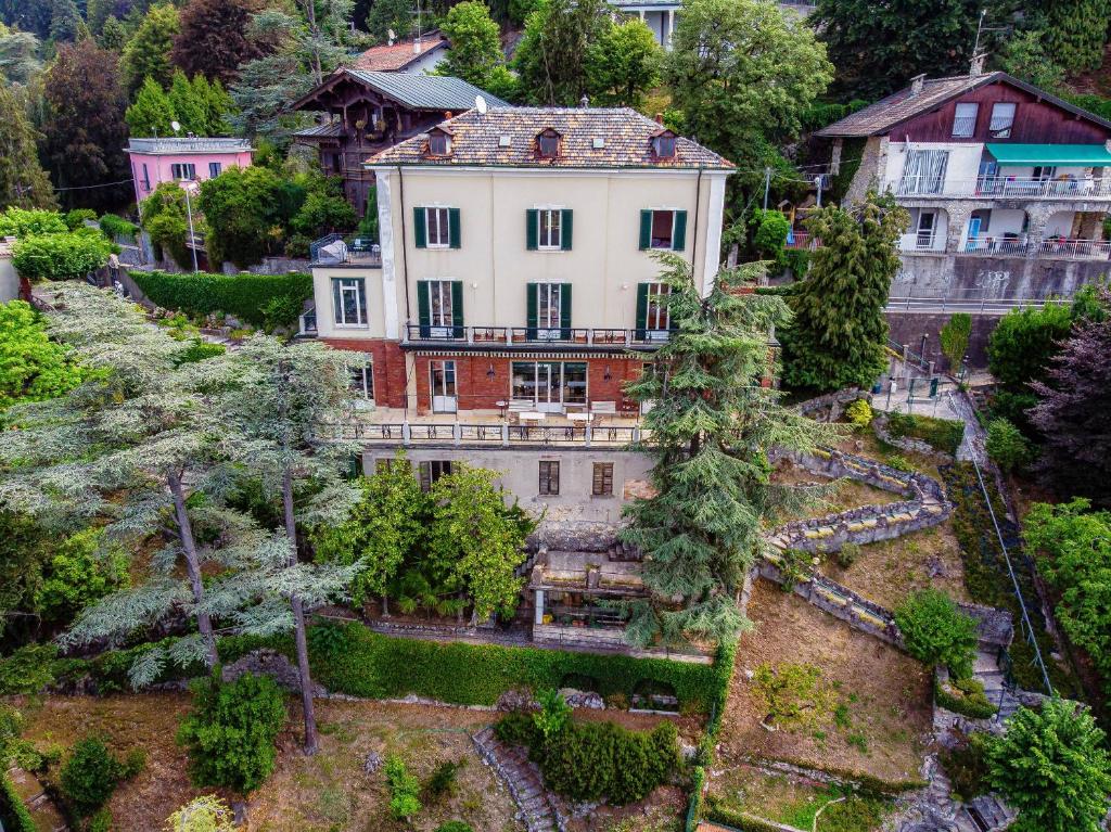 an aerial view of a large house with trees at Villa I Tigli - by MyHomeInComo in Brunate
