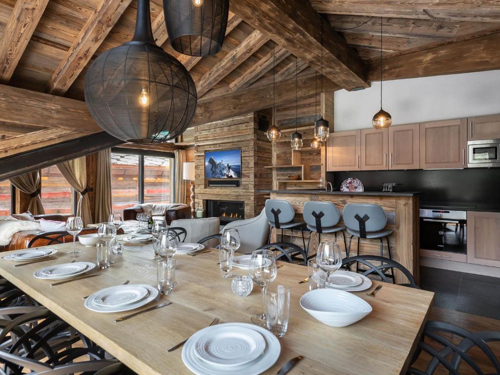 a dining room with a wooden table and chairs at Chalet Val-d'Isère, 5 pièces, 10 personnes - FR-1-567-34 in Val-d'Isère