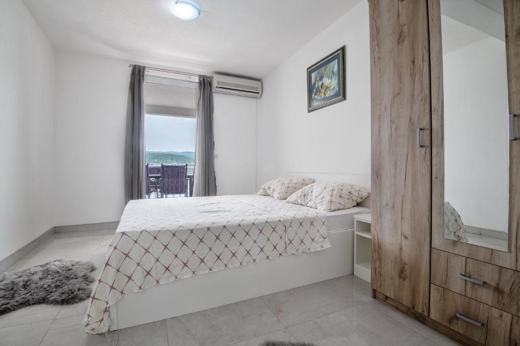 Postel nebo postele na pokoji v ubytování Apartmani Dodig
