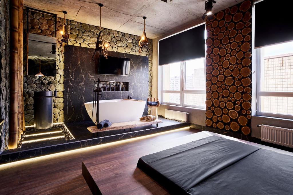 Postel nebo postele na pokoji v ubytování KADOR HOME HOTEL downtown