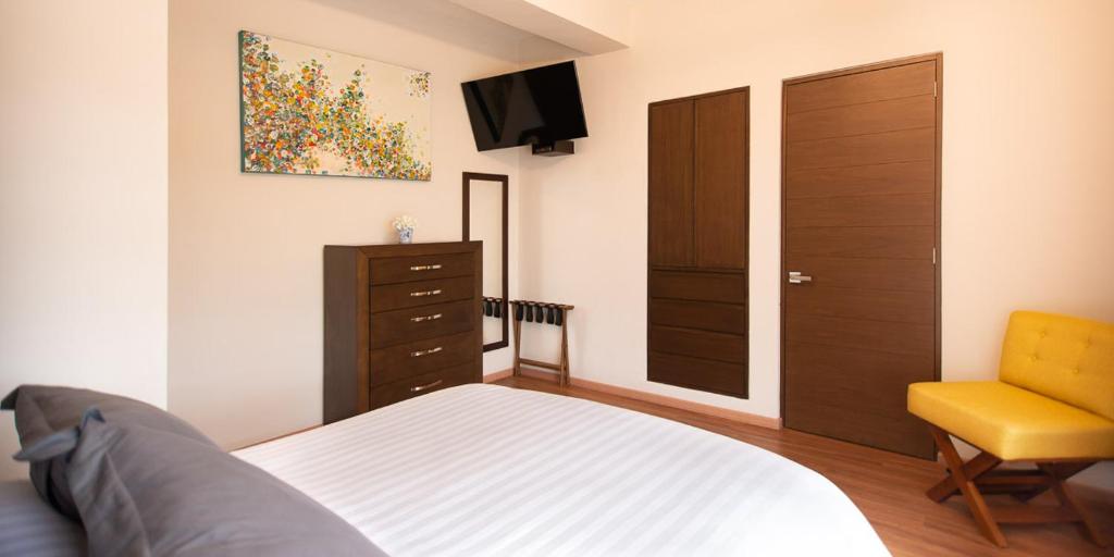 Postel nebo postele na pokoji v ubytování Hotel Posada XR