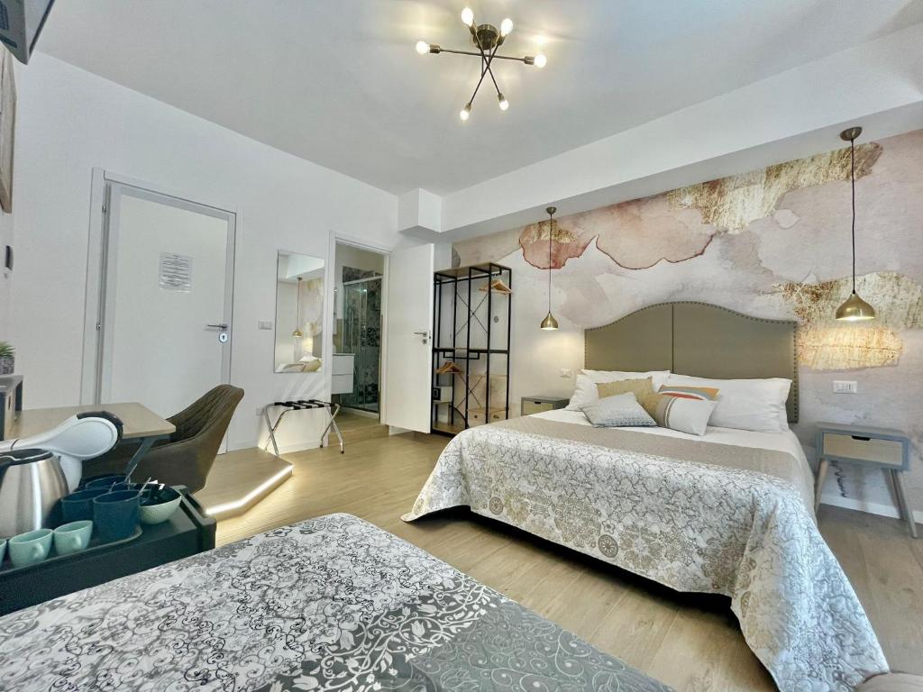 Postel nebo postele na pokoji v ubytování BARIROOMS - Melo Suites