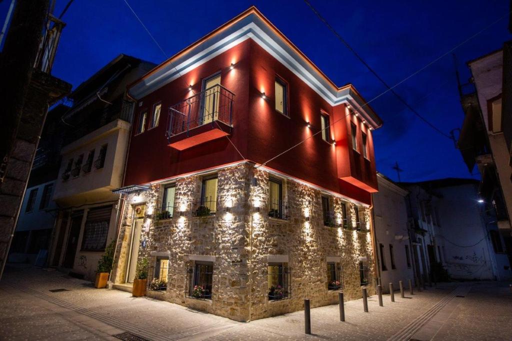 a building with christmas lights on the side of it at ΟNIRO Comfort Living in Ioannina