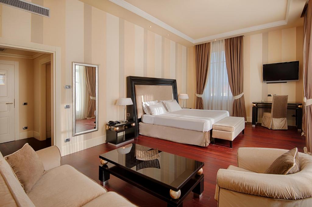 Cama o camas de una habitación en GH Palazzo Suite & SPA