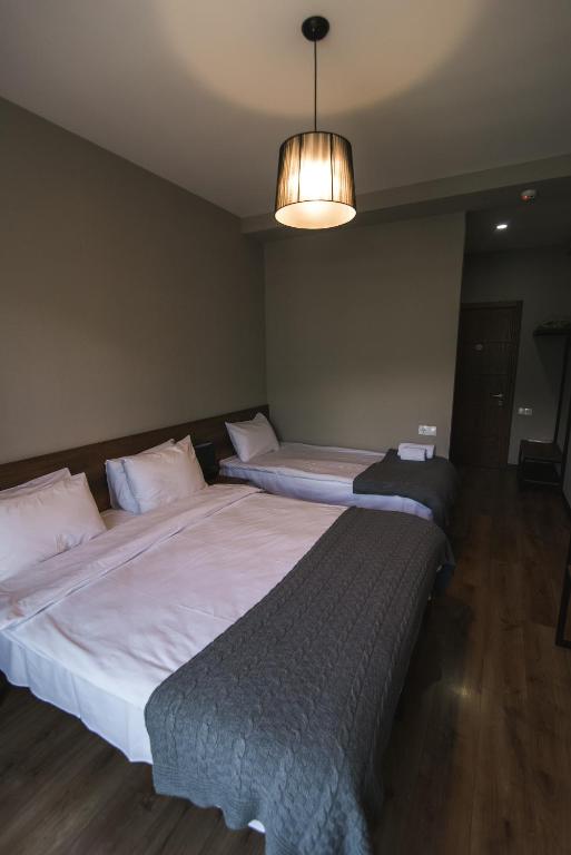 Letto o letti in una camera di Hilltop Kazbegi