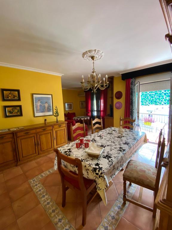 a dining room with a table and chairs at luxury's villas in Villacarrillo