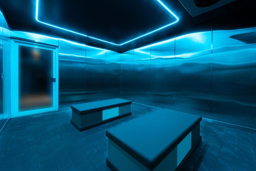 a room with blue lights on the ceiling at The Standard Miami in Miami Beach