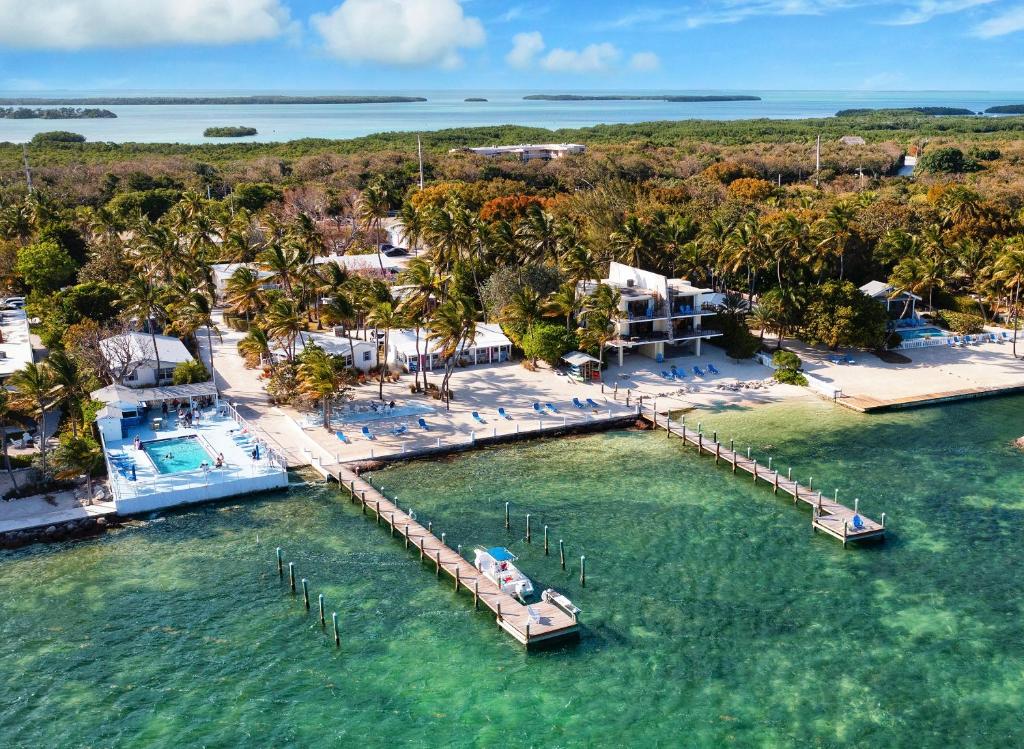 an aerial view of a resort with a dock in the water at Pines & Palms Resort in Islamorada