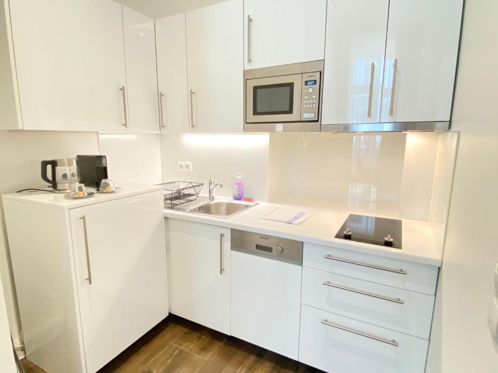 Kuchyňa alebo kuchynka v ubytovaní Steiner Residences Vienna Taborstrasse