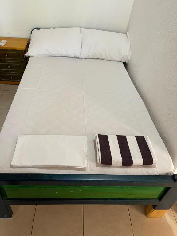Posteľ alebo postele v izbe v ubytovaní Alexiou Guesthouse Pilion Katigiorgis