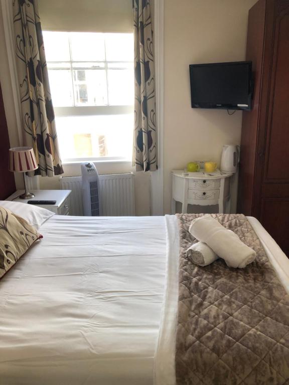 Postel nebo postele na pokoji v ubytování Brighton Surf Guest House